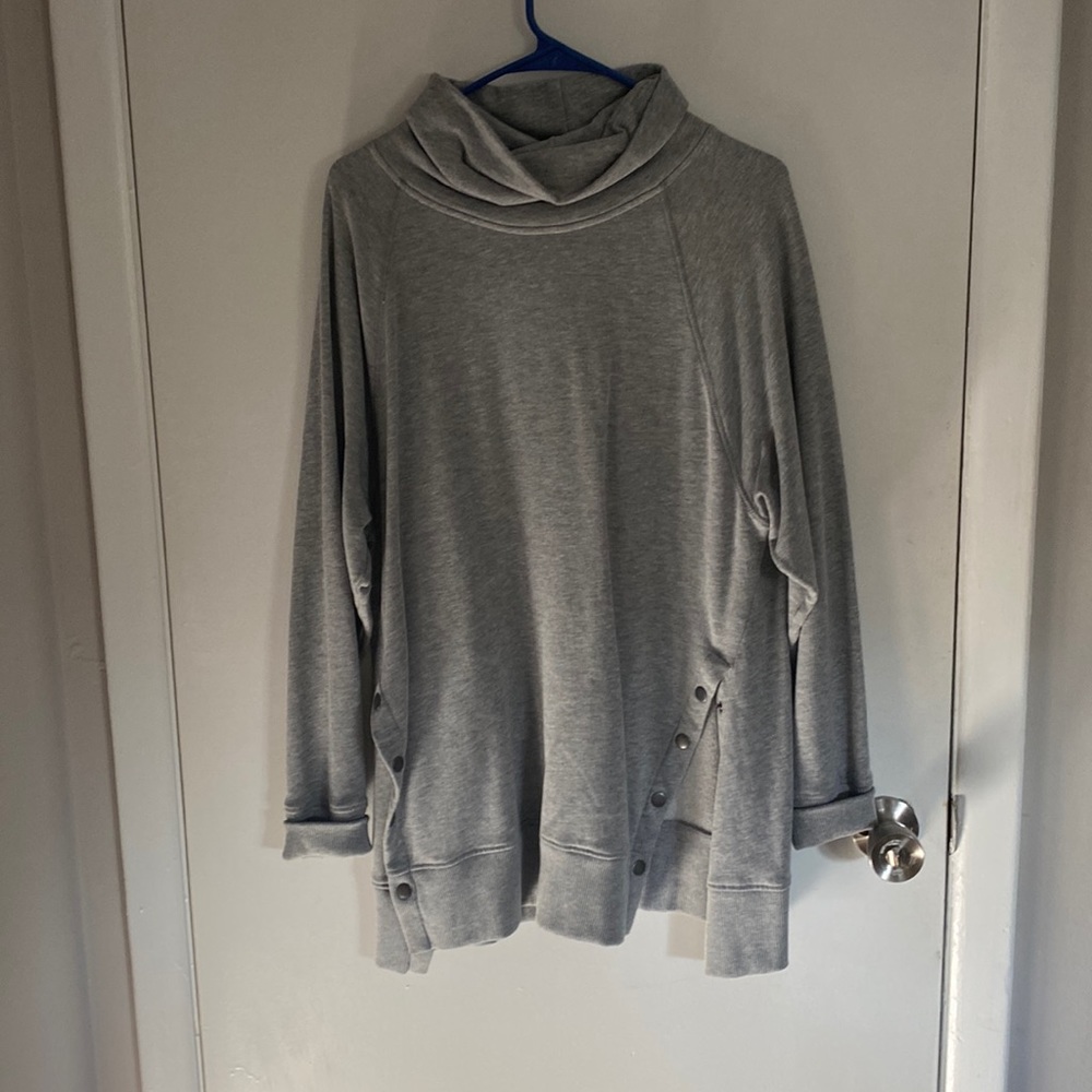 Turtle neck sweater with buttons up both sides